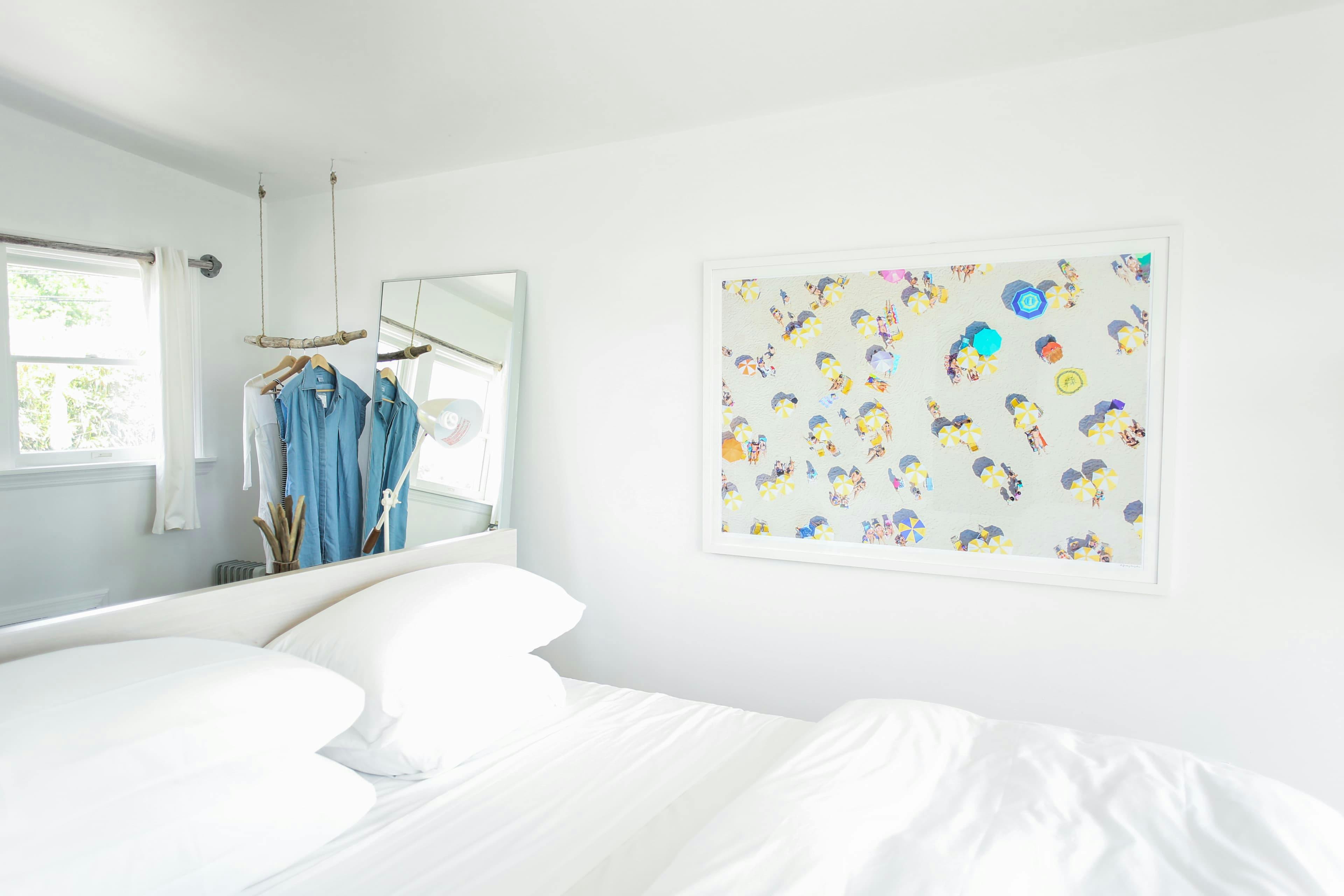 A framed print in a bedroom